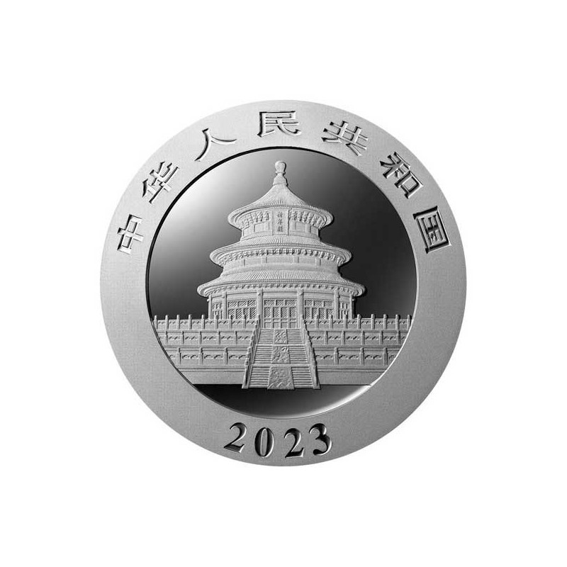 Moneda china color plata con dragón y símbolos de la suerte
